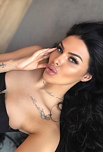 Ukrainian mail order bride Ksenia from Rivne with black hair and green eye color - image 4