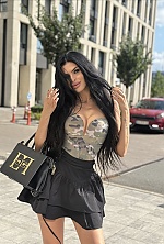 Ukrainian mail order bride Ksenia from Rivne with black hair and green eye color - image 5