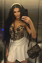 Ukrainian mail order bride Ksenia from Rivne with black hair and green eye color - image 9