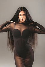 Ukrainian mail order bride Ksenia from Rivne with black hair and green eye color - image 11