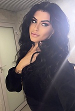 Ukrainian mail order bride Ksenia from Rivne with black hair and green eye color - image 7