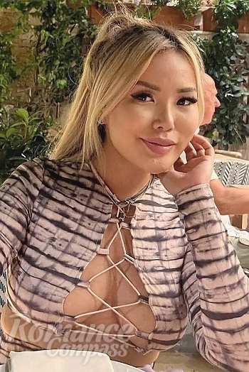 Ukrainian mail order bride Aigerim from Almaty with blonde hair and brown eye color - image 1