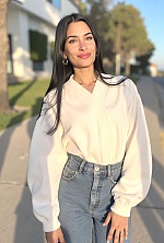 Ukrainian mail order bride Magali from Paraná with black hair and green eye color - image 7