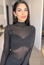 Ukrainian mail order bride Magali from Paraná with black hair and green eye color - image 28