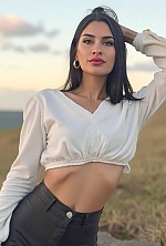 Ukrainian mail order bride Magali from Paraná with black hair and green eye color - image 14