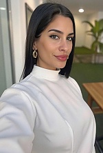 Ukrainian mail order bride Magali from Paraná with black hair and green eye color - image 36