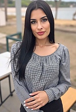 Ukrainian mail order bride Magali from Paraná with black hair and green eye color - image 21