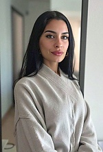 Ukrainian mail order bride Magali from Paraná with black hair and green eye color - image 11