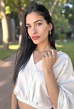 Ukrainian mail order bride Magali from Paraná with black hair and green eye color - image 10