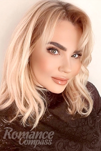 Ukrainian mail order bride Lyudmila from Paris with blonde hair and green eye color - image 1