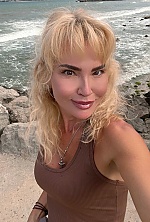 Ukrainian mail order bride Lyudmila from Paris with blonde hair and green eye color - image 9