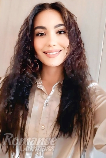 Ukrainian mail order bride Kseniia from Kyiv with black hair and black eye color - image 1