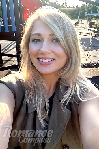 Ukrainian mail order bride Yuliia from Sumy with blonde hair and green eye color - image 1
