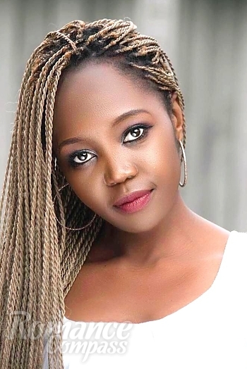 Ukrainian mail order bride Tina from Harare with brunette hair and brown eye color - image 1