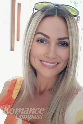 Ukrainian mail order bride Natalia from Odesa with blonde hair and blue eye color - image 1