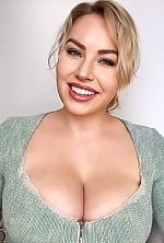 Ukrainian mail order bride Yuliia from Kyiv with blonde hair and green eye color - image 6