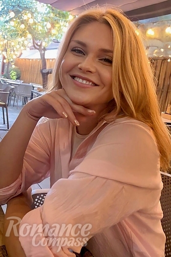 Ukrainian mail order bride Oksana from Costești with blonde hair and hazel eye color - image 1