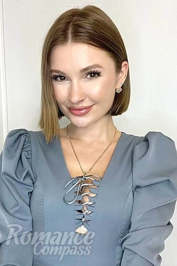 Ukrainian mail order bride Irina from Almaty with light brown hair and brown eye color - image 1