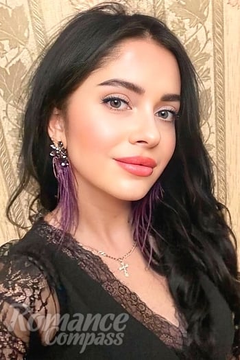 Ukrainian mail order bride Irena from Odesa with black hair and green eye color - image 1