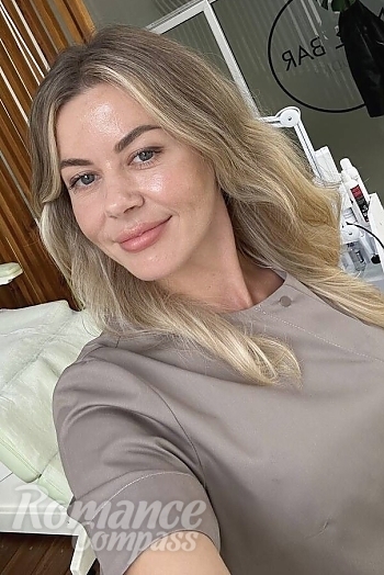 Ukrainian mail order bride Oksana from Rivne with blonde hair and blue eye color - image 1