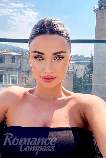 Ukrainian mail order bride Christina from Tbilisi with light brown hair and blue eye color - image 1