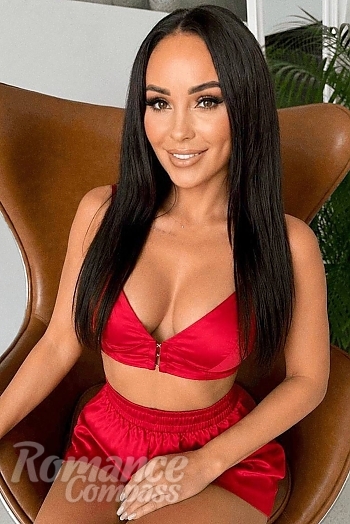 Ukrainian mail order bride Anastasia from Kyiv with black hair and green eye color - image 1