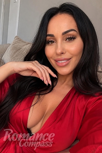 Ukrainian mail order bride Anastasia from Kyiv with black hair and green eye color - image 1