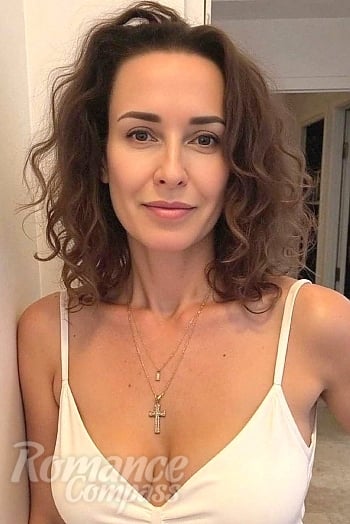 Ukrainian mail order bride Olga from Cannes with brunette hair and brown eye color - image 1