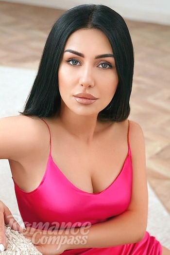 Ukrainian mail order bride Zhanna from Kyiv with black hair and green eye color - image 1