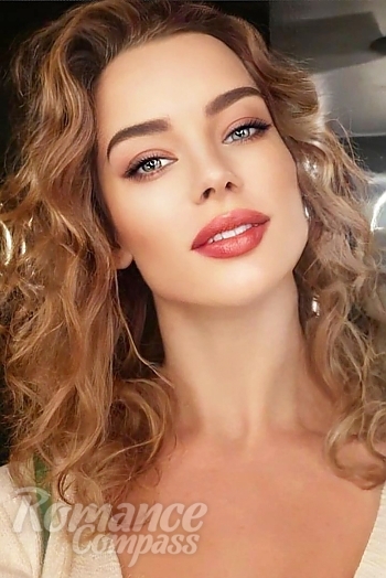 Ukrainian mail order bride Anna from Kyiv with light brown hair and green eye color - image 1