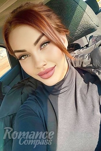 Ukrainian mail order bride Alyona from Kyiv with red hair and green eye color - image 1