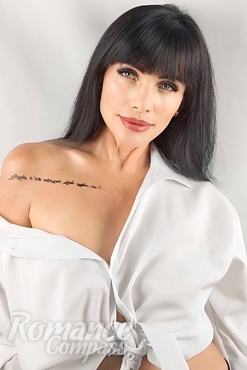 Ukrainian mail order bride Ekaterina from Kyiv with black hair and blue eye color - image 1