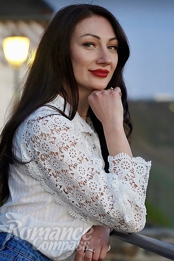 Ukrainian mail order bride Olha from Trier with black hair and grey eye color - image 1