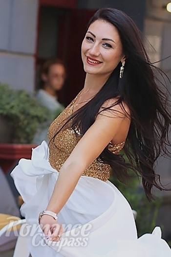 Ukrainian mail order bride Olha from Trier with black hair and grey eye color - image 1