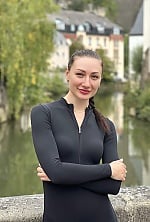 Ukrainian mail order bride Olha from Trier with black hair and grey eye color - image 10