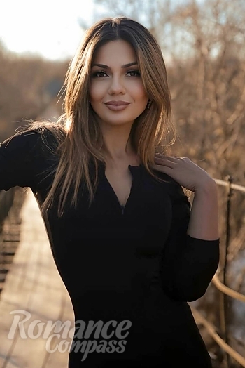 Ukrainian mail order bride Bohdana from Luxembourg with light brown hair and hazel eye color - image 1