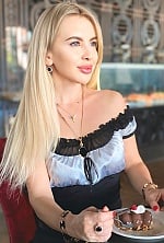 Ukrainian mail order bride Olesia from Kyiv with light brown hair and green eye color - image 11