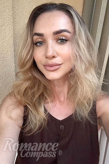 Ukrainian mail order bride Olesya from Dubai with light brown hair and grey eye color - image 1