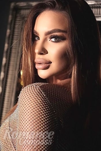 Ukrainian mail order bride Oleksandra from Kyiv with auburn hair and green eye color - image 1