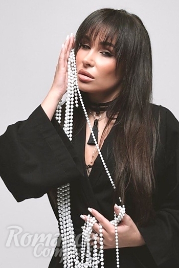 Ukrainian mail order bride Ekaterina from Luxembourg with black hair and green eye color - image 1