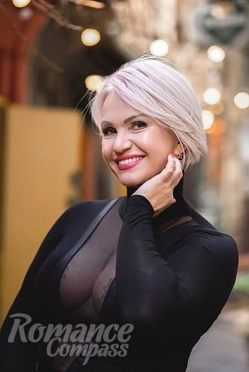 Ukrainian mail order bride Nataliia from Kyiv with blonde hair and hazel eye color - image 1