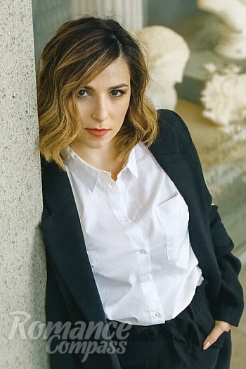 Ukrainian mail order bride Ksenia from Prague with light brown hair and green eye color - image 1