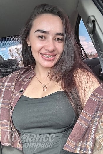 Ukrainian mail order bride Ilona from Kharkiv with black hair and brown eye color - image 1