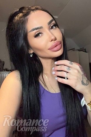 Ukrainian mail order bride Olena from Berlin with black hair and hazel eye color - image 1