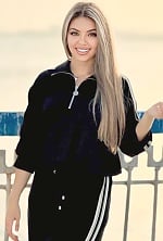 Ukrainian mail order bride Regina from Temirtau with light brown hair and green eye color - image 2