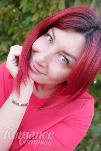 Ukrainian mail order bride Elena from Kyiv with red hair and green eye color - image 1