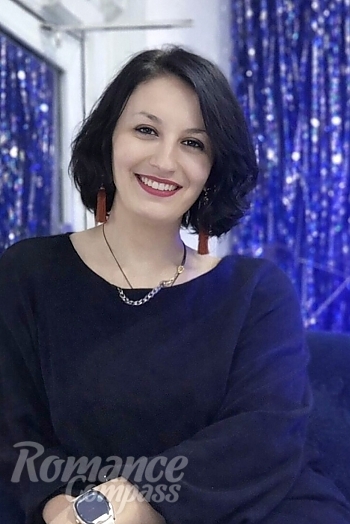 Ukrainian mail order bride Nadiia from Kaniv with light brown hair and blue eye color - image 1