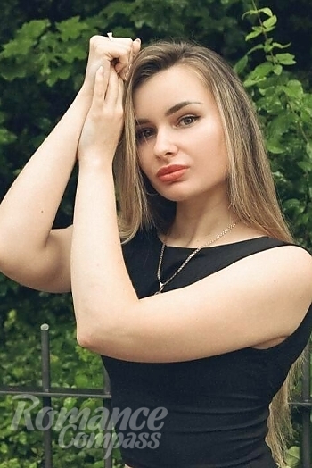 Ukrainian mail order bride Valeriia from Prague with light brown hair and hazel eye color - image 1