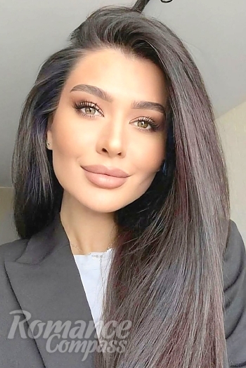 Ukrainian mail order bride Oksana from Kyiv with light brown hair and brown eye color - image 1