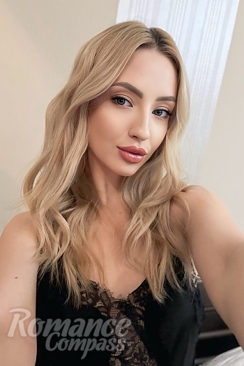 Ukrainian mail order bride Yulia from Kyiv with blonde hair and blue eye color - image 1